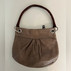 Mini Roots leather hand bag.